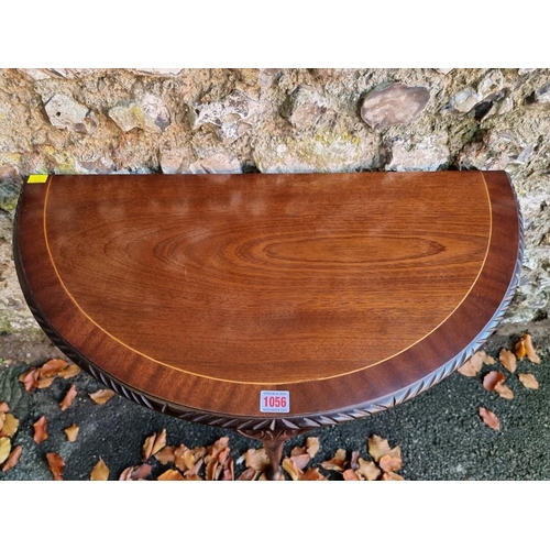 1056 - An inlaid mahogany console table, 66cm wide x 75cm high. 