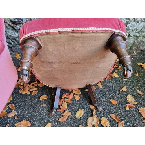 1057 - Two red upholstered nursing chairs. 