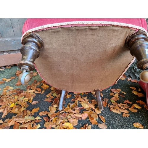 1057 - Two red upholstered nursing chairs. 