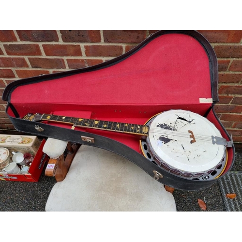 1074 - A Roma banjo; together with a violin in case and a trumpet.