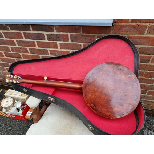 1074 - A Roma banjo; together with a violin in case and a trumpet.