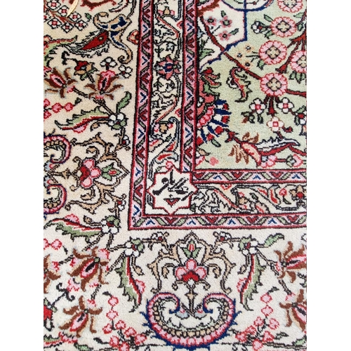 1079 - A large Persian carpet, having large central medallion, with floral central field on a green ground,... 