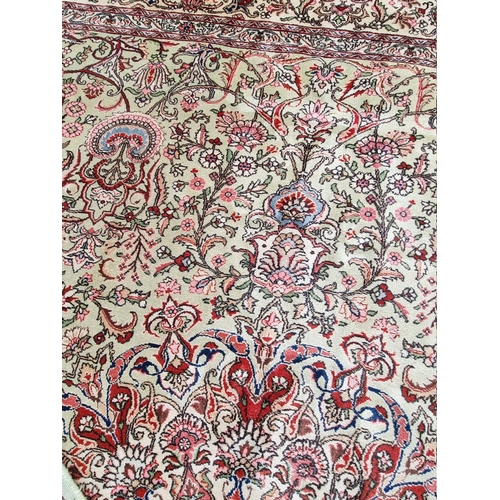 1079 - A large Persian carpet, having large central medallion, with floral central field on a green ground,... 