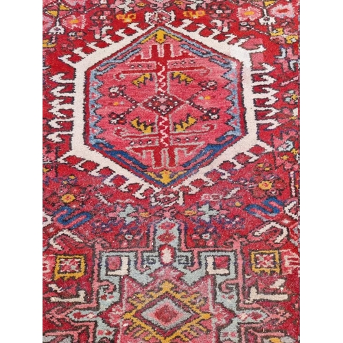 1080 - A Persian runner, having seven central medallions, with floral decoration, 280 x 85cm.... 