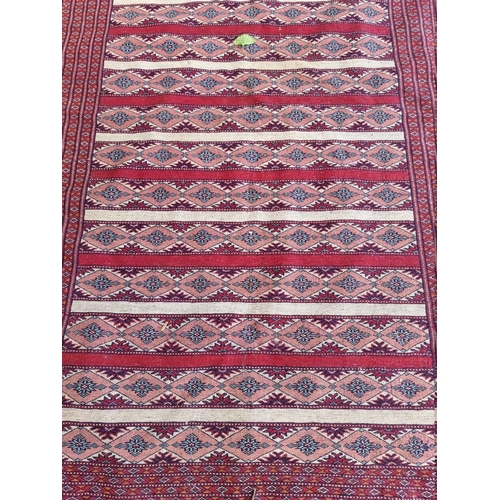 1083 - A Bokhara rug, having allover repeated design, 194 x 120cm wide. 