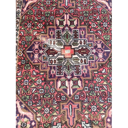 1084 - A Persian rug, having central diamond with geometric and floral borders, 153 x 98cm. ... 