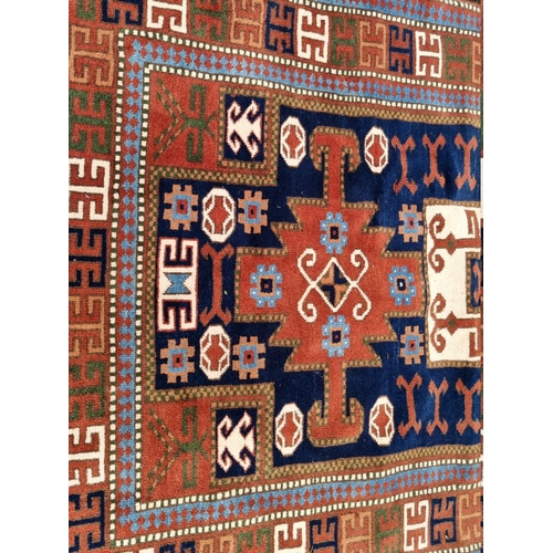 1099 - A Persian rug, having allover geometric field, 180 x 122cm; together with a Bokhara rug, 1... 