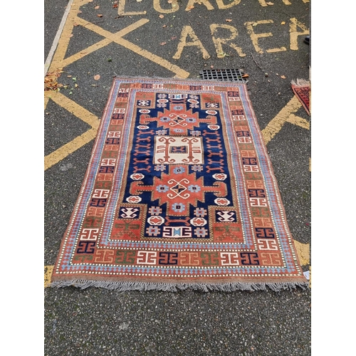 1099 - A Persian rug, having allover geometric field, 180 x 122cm; together with a Bokhara rug, 1... 