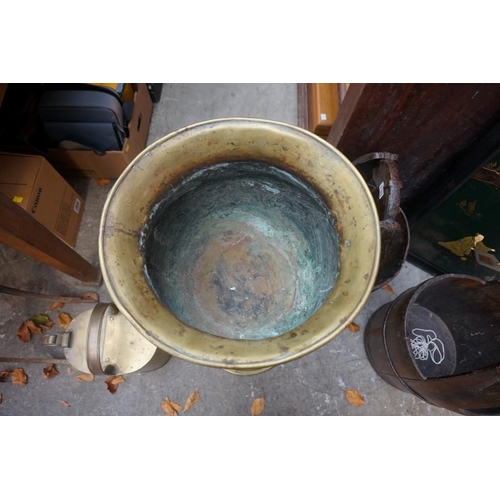 1102 - An old embossed brass pedestal jardiniere, 83.5cm high; together with a brass watering can. (2)... 