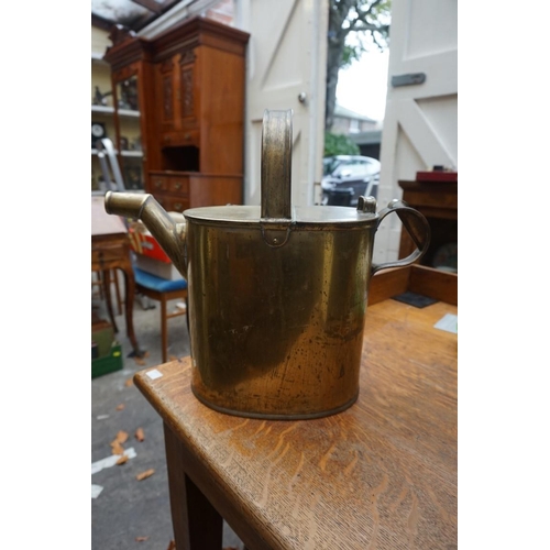 1102 - An old embossed brass pedestal jardiniere, 83.5cm high; together with a brass watering can. (2)... 