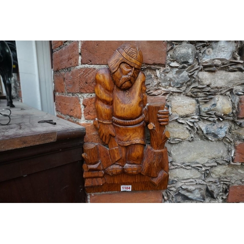 1104 - A Russian carved pine figural plaque, labelled verso, 41cm high.