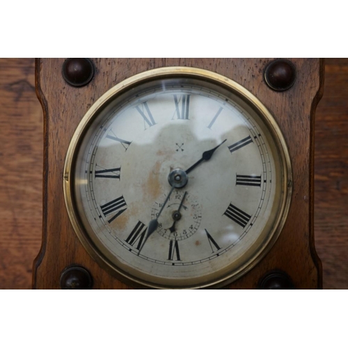 1106 - A Continental walnut postman's alarm wall clock, 29cm high.