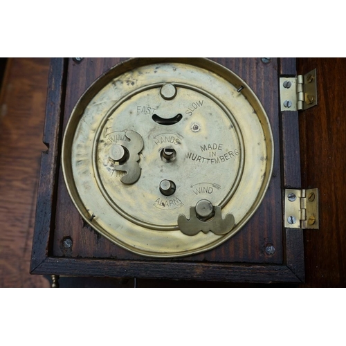 1106 - A Continental walnut postman's alarm wall clock, 29cm high.