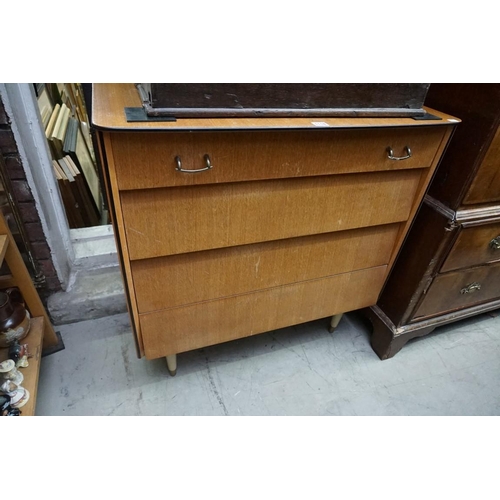 1118 - A mid century oak four drawer chest, 85cm wide; together with a similar formica kitchen table, 90cm ... 