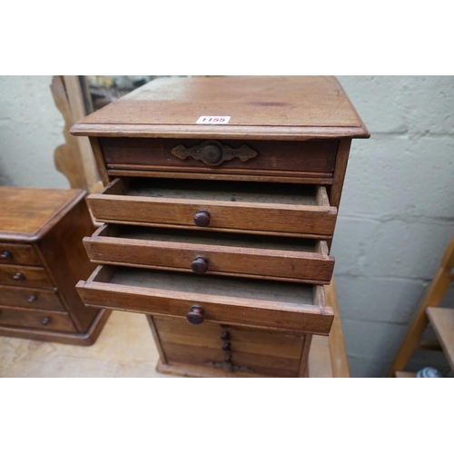 1155 - A miniature mahogany chest of eleven small drawers, 49cm high x 30cm wide x 25cm deep. ... 