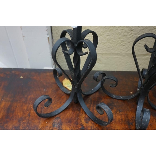 1167 - A pair of wrought iron pricket candlesticks, 37.5cm high. 