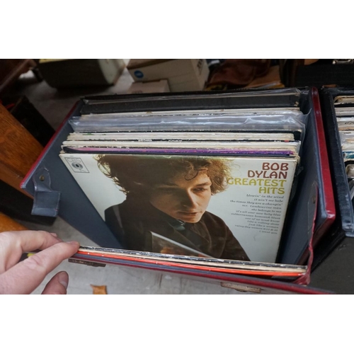 1175 - A collection of 33rpm vinyl records, to include: The Beatles, Rolling Stones, Bob Dylan, etc. in thr... 