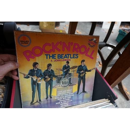 1175 - A collection of 33rpm vinyl records, to include: The Beatles, Rolling Stones, Bob Dylan, etc. in thr... 