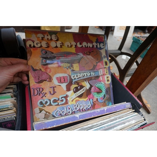 1175 - A collection of 33rpm vinyl records, to include: The Beatles, Rolling Stones, Bob Dylan, etc. in thr... 