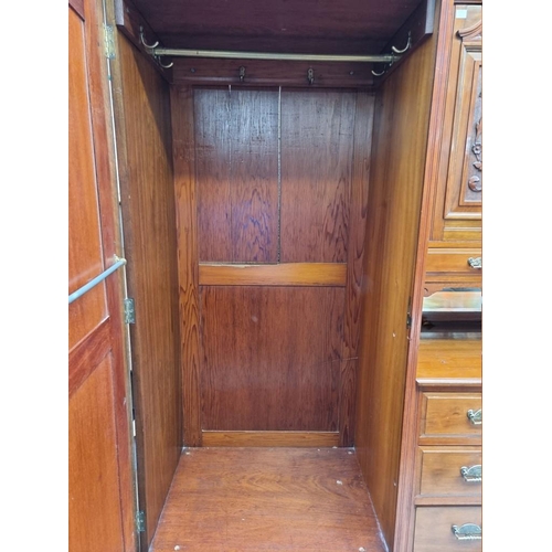 1206 - An Edwardian carved walnut wardrobe, 156.5cm wide.