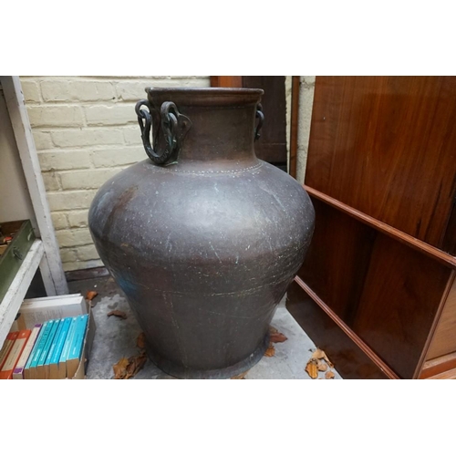 1207 - An oversized copper vessel, 74cm high.