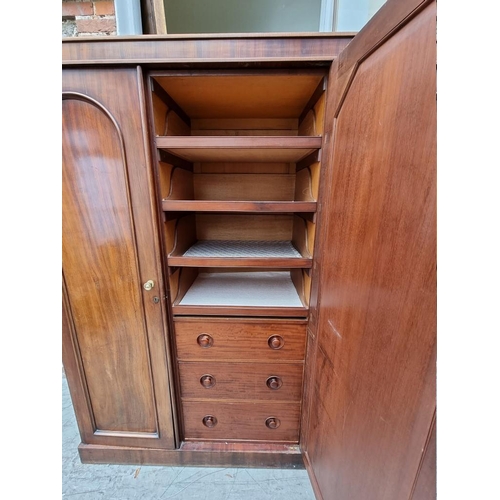 1209 - A Victorian mahogany triple wardrobe, 176cm wide. Provenance: by repute from Parham House.... 