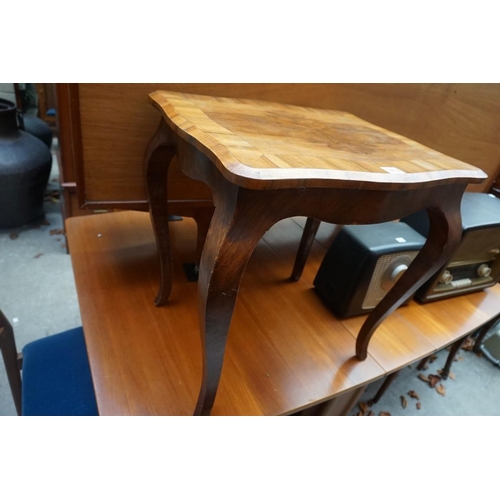 1219 - A walnut low occasional table, 52cm wide.