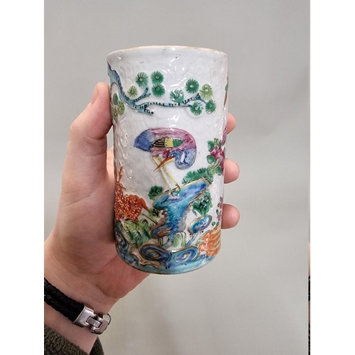 1284 - A Chinese famille rose sleeve vase or brush pot, late 19th century, relief decorated on a textured g... 