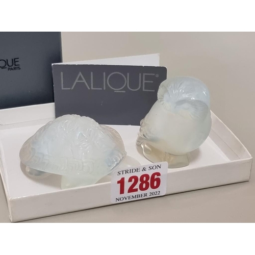 1286 - Two Lalique opalescent animal paperweights, comprising a turtle, boxed; and an owl.