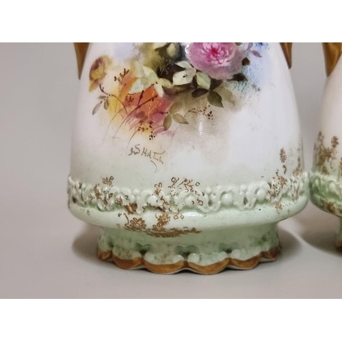 1287 - A pair of Doulton Burslem twin handled vases, each painted with flowers by S Hall, 16cm high.... 