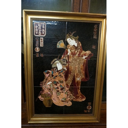 1307 - A set of three Maw & Co tile pictures, each depicting oriental figures, 60 x 39cm; together with... 