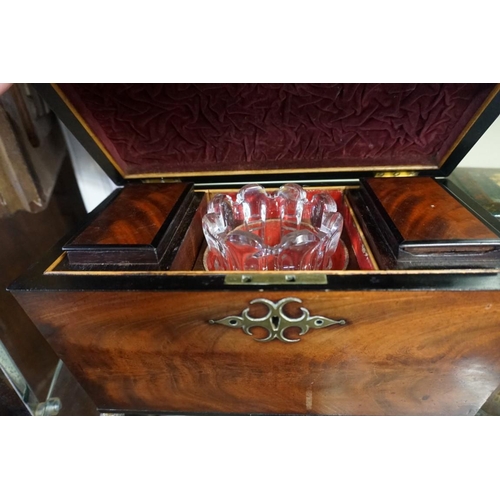 1315 - A Regency mahogany and brass inlaid sarcophagus tea caddy, 32.5cm wide. 