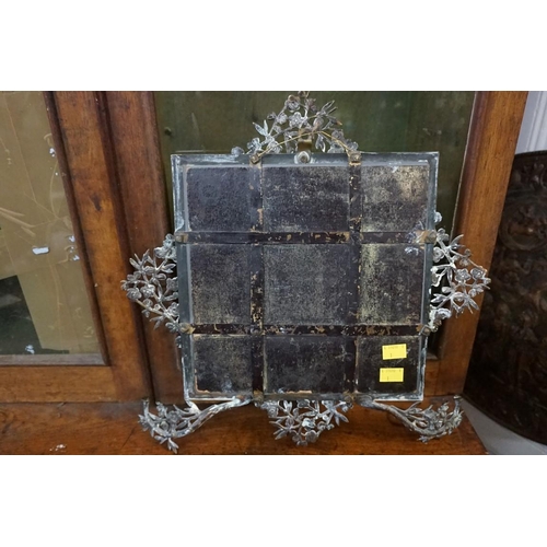 1328 - An Aesthetic brass framed mirror, by Townsend & Co, 40 x 41cm.