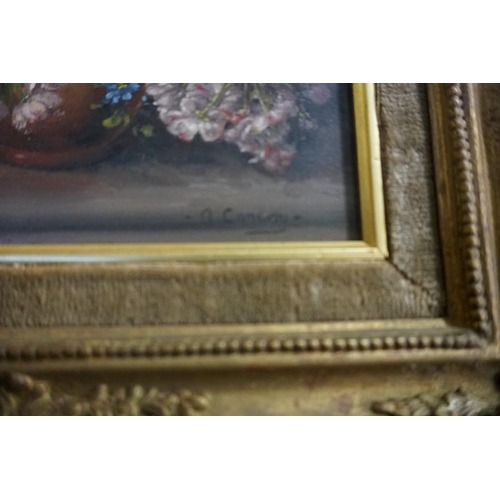 1330 - A Conway, still life of flowers, signed, Harrods label verso, oil on board, 24 x 19.5cm.... 