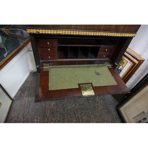 1375 - A mahogany and parcel gilt secretaire bookcase, with mirror panelled door, 67cm wide.... 