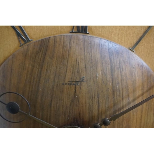 1382 - A vintage walnut and maple electric wall clock, by Kienzle, 30cm diameter.