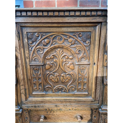 1393 - A good 17th century style carved oak court cupboard, 123cm wide. 