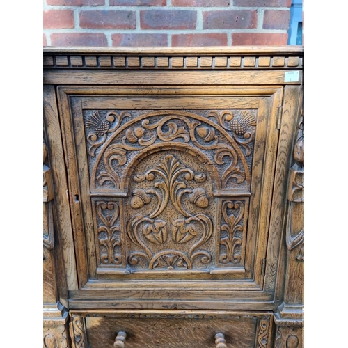 1393 - A good 17th century style carved oak court cupboard, 123cm wide. 