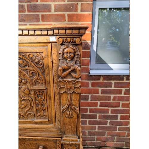 1393 - A good 17th century style carved oak court cupboard, 123cm wide. 