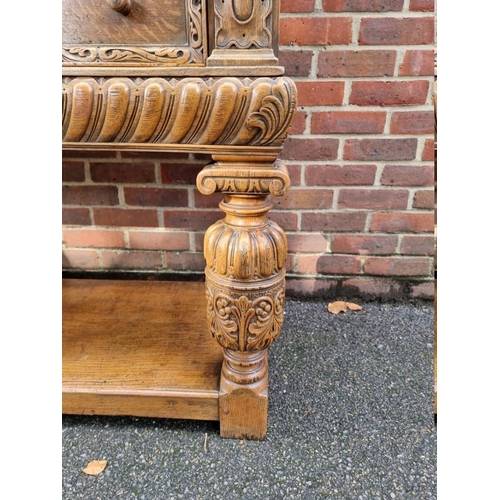 1393 - A good 17th century style carved oak court cupboard, 123cm wide. 