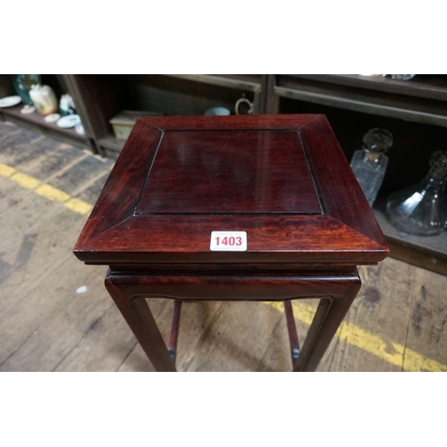 1403 - A Chinese hardwood jardiniere stand, 49cm high x 27.5cm wide.