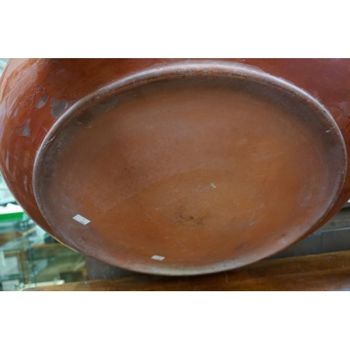 1406 - A large Watcombe pottery charger, 58.5cm diameter, (chip to rim). 