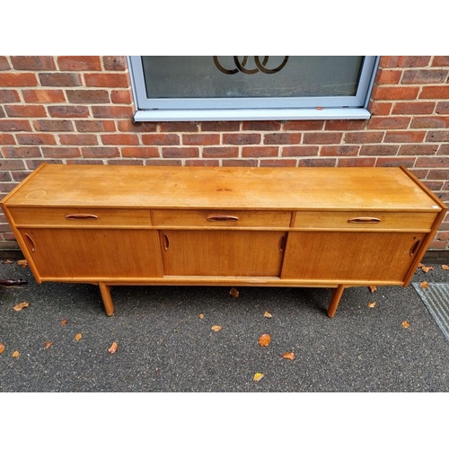 1409 - A mid century teak sideboard, 199cm wide. 