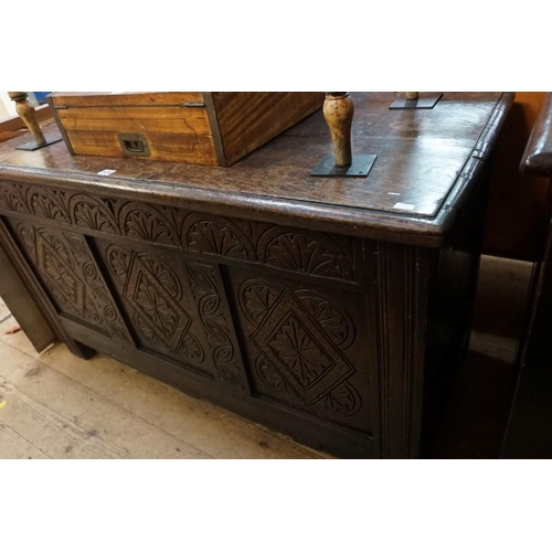 1416 - A late 17th century carved oak panelled coffer, 125cm wide. 