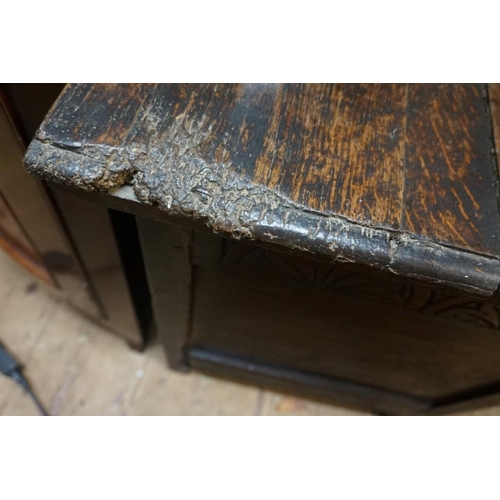 1416 - A late 17th century carved oak panelled coffer, 125cm wide. 