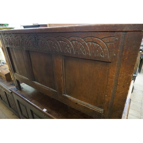 1419 - A late 17th century carved oak panelled coffer, 125.5cm wide.