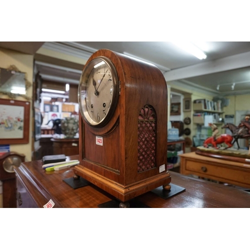 1423 - An early 20th century walnut dome top mantel clock, striking on two gongs, 35.5cm high, with pe... 