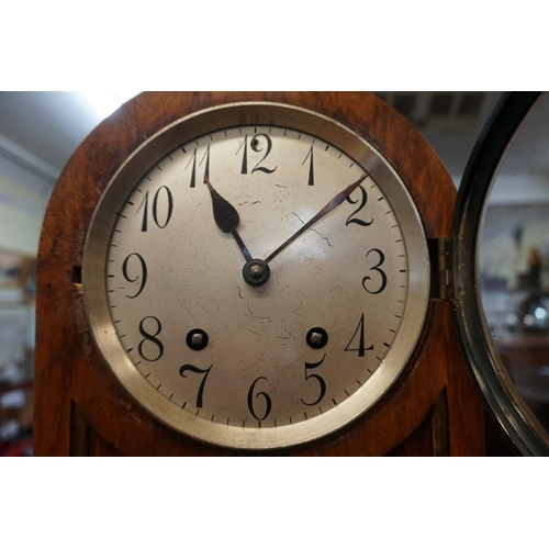 1423 - An early 20th century walnut dome top mantel clock, striking on two gongs, 35.5cm high, with pe... 