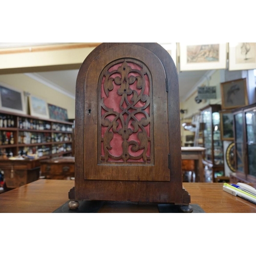 1423 - An early 20th century walnut dome top mantel clock, striking on two gongs, 35.5cm high, with pe... 