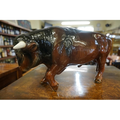 1425 - A Melba ware Hereford bull, 41cm long; together with a Sylvac bull, 36cm long. ... 